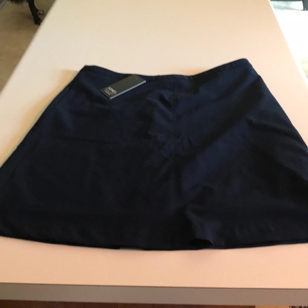 Brand new navy slightly a-line skirt.